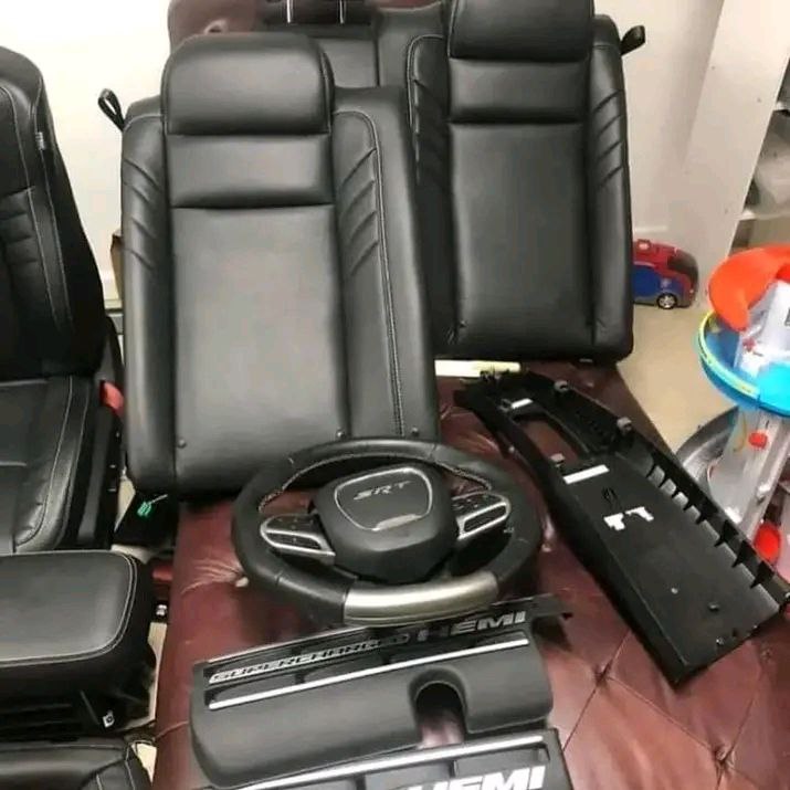car wheels and seat cushion, backrest, head restraint, seat belt, arm rest